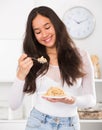 Girl eating useful mixture of cereals