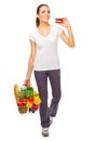 Young smiling girl food basket and credit card