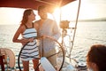 Young girl sailing on the luxury boat with man and enjoy at sunset Royalty Free Stock Photo