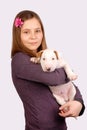 Young smiling girl with white bullterrier puppy. Royalty Free Stock Photo