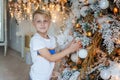 Young boy decorating Christmas tree Royalty Free Stock Photo