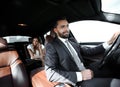 Attractive elegant serious man drives good car Royalty Free Stock Photo