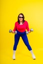 Young smiling happy chubby overweight plus size big fat fit woman warm up training hold dumbbells Royalty Free Stock Photo