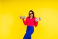Young smiling happy chubby overweight plus size big fat fit woman warm up training hold dumbbells Royalty Free Stock Photo