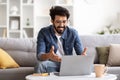 Young Smiling Indian Man Making Video Call On Laptop At Home Royalty Free Stock Photo