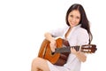 Young smiling lady playing acoustic guitar Royalty Free Stock Photo