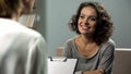 Young smiling lady at rehab therapy session, help from psychologist, improvement Royalty Free Stock Photo