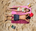 Young smiling lovers sunbathing Royalty Free Stock Photo