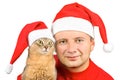Young smiling man and cat in Santa's hat
