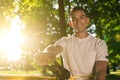 Young smiling man in the forest practising slacklining Royalty Free Stock Photo