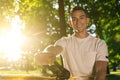 Young smiling man in the forest practising slacklining