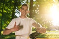 Young smiling man in the forest practising slacklining