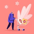 Young Smiling Man in Winter Clothing Pushing Shopping Cart with Frozen Food Packaging in Supermarket