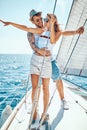 Young man with girl on a sailing boat -Romantic vacation and luxury travel Royalty Free Stock Photo