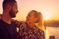 Young man and womanoutdoor dating in sunset