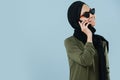 Young smiling muslim girl talking on the phone Royalty Free Stock Photo