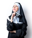 Young smiling nun with photo camera Royalty Free Stock Photo