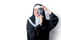 Young smiling nun with photo camera Royalty Free Stock Photo