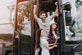 Young Smiling People Traveling on Tourist Bus Royalty Free Stock Photo