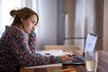 Young smiling pretty woman student using laptop Royalty Free Stock Photo