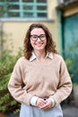 Young smiling professional business woman standing outdoor, vertical portrait. Royalty Free Stock Photo