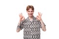 young smiling red-haired man dressed in a summer short-sleeved shirt in black and white Royalty Free Stock Photo