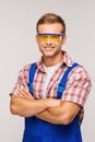 Young smiling repairman in eyewear