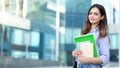 Young smiling student holding books, study, education, knowledge, goal concept Royalty Free Stock Photo