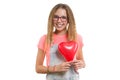 Young smiling teen girl congratulating on holiday with red heart balloon on isolated white background Royalty Free Stock Photo