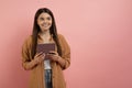 Young Smiling Teen Girl Holding Digital Tablet And Looking Away Royalty Free Stock Photo