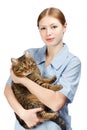 Young smiling veterinarian woman hugging adult scared tabby cat Royalty Free Stock Photo