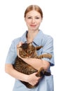 Young smiling veterinarian woman hugging adult scared tabby cat Royalty Free Stock Photo