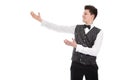 Young smiling waiter or butler gesturing welcome - isolated on w Royalty Free Stock Photo