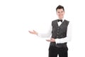 Young smiling waiter or butler gesturing welcome - isolated on w Royalty Free Stock Photo