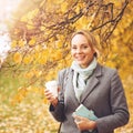 Young smiling woman  in autumn park Royalty Free Stock Photo