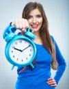 Young smiling woman in blue hold watch. Beautiful smiling girl Royalty Free Stock Photo