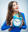 Young smiling woman in blue hold watch. Beautiful smiling girl Royalty Free Stock Photo