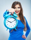 Young smiling woman in blue hold watch. Beautiful smiling girl Royalty Free Stock Photo