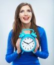 Young smiling woman in blue hold watch. Beautiful smiling girl Royalty Free Stock Photo