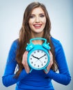 Young smiling woman in blue hold watch. Beautiful smiling girl Royalty Free Stock Photo