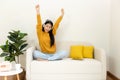 Young smiling women chill & relax raise arm after working and meeting at home.