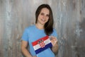 A young smiling woman with a Croatia flag in her hand. Royalty Free Stock Photo