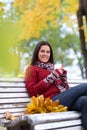 Young smiling woman with cup of tea in autumn park Royalty Free Stock Photo