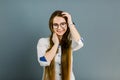 Young smiling woman doctor in big glasses. Portrait of a young female professional cosmetologist. Healthcare occupation Royalty Free Stock Photo