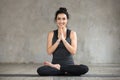 Young smiling woman doing Lotus exercise