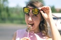 Funny woman eating a chocolate candy. Royalty Free Stock Photo