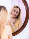 woman looking at mirror Royalty Free Stock Photo