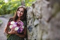 Young smiling woman with flowers