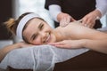 Young smiling woman getting firming sugar scrub therapy on her b Royalty Free Stock Photo