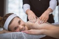 Young smiling woman getting firming sugar scrub therapy on her b Royalty Free Stock Photo